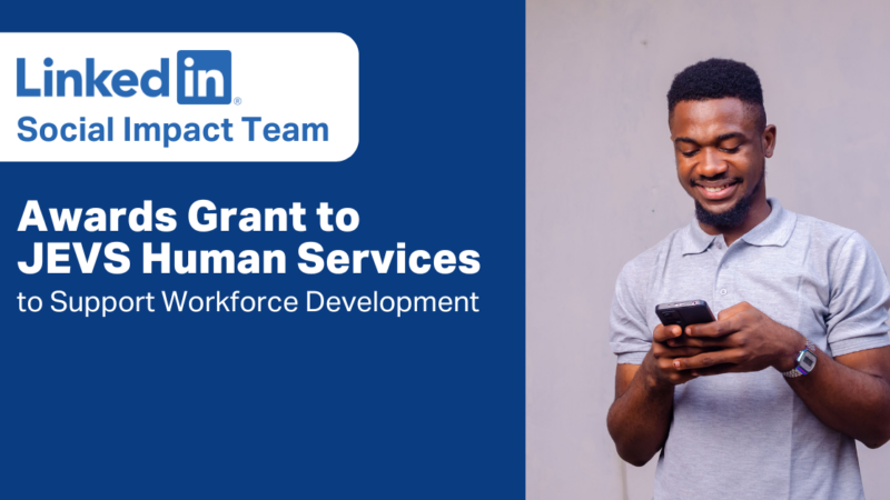 Picture of man typing on a cell phone with the text: LinkedIn Social Impact Team Awards Grant to JEVS Human Services to Support Workforce Development